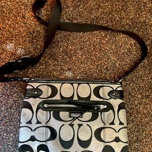 Black and gray Coach crossbody